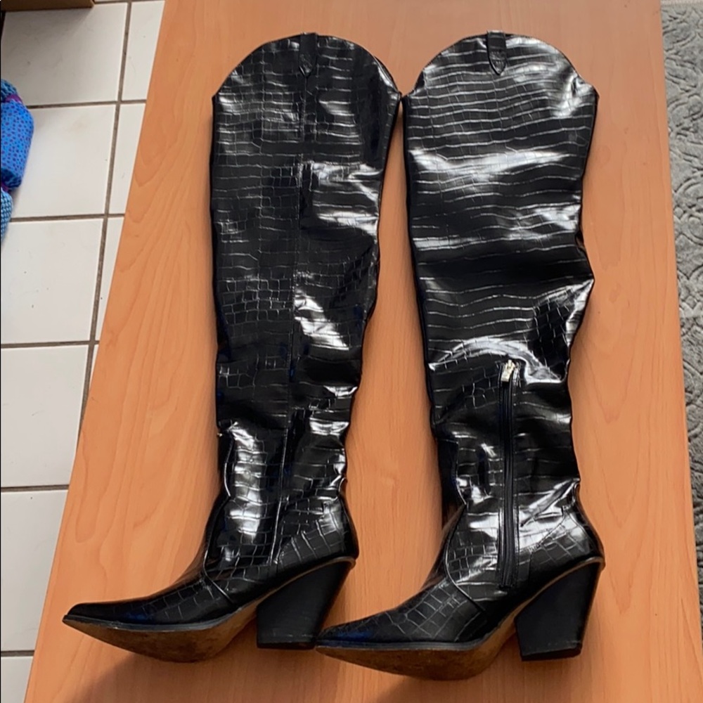 Thigh high cowboy boot